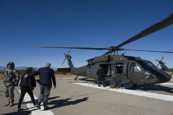 Secretary of Defense, Chuck Hagel, and his wife, Lilibet, walk to board an H-60 Black Hawk